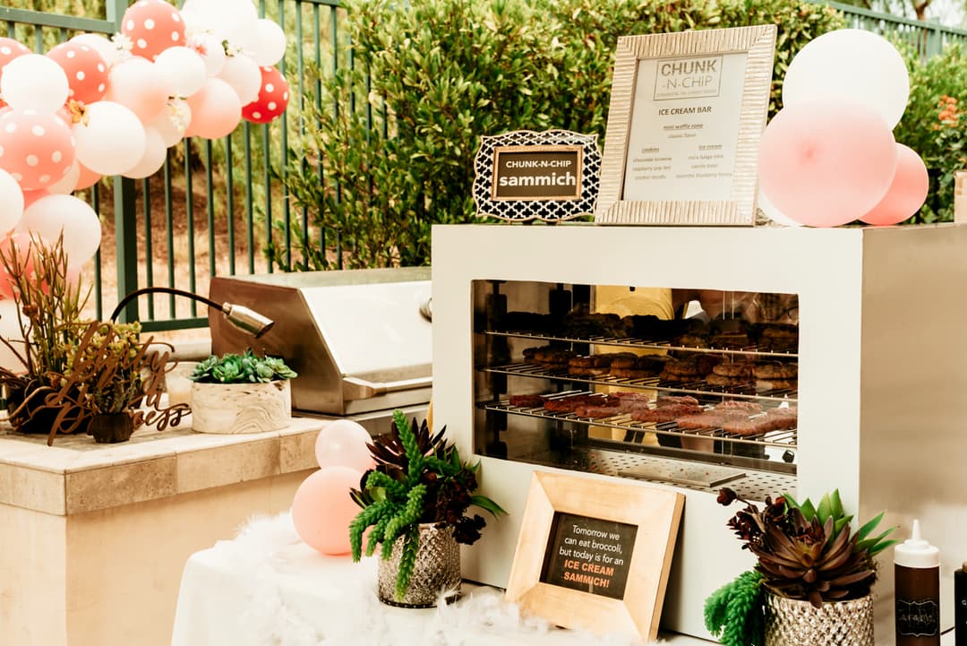 Chunk-N-Chip ice cream sammich station decorated with pink balloons at a birthday party