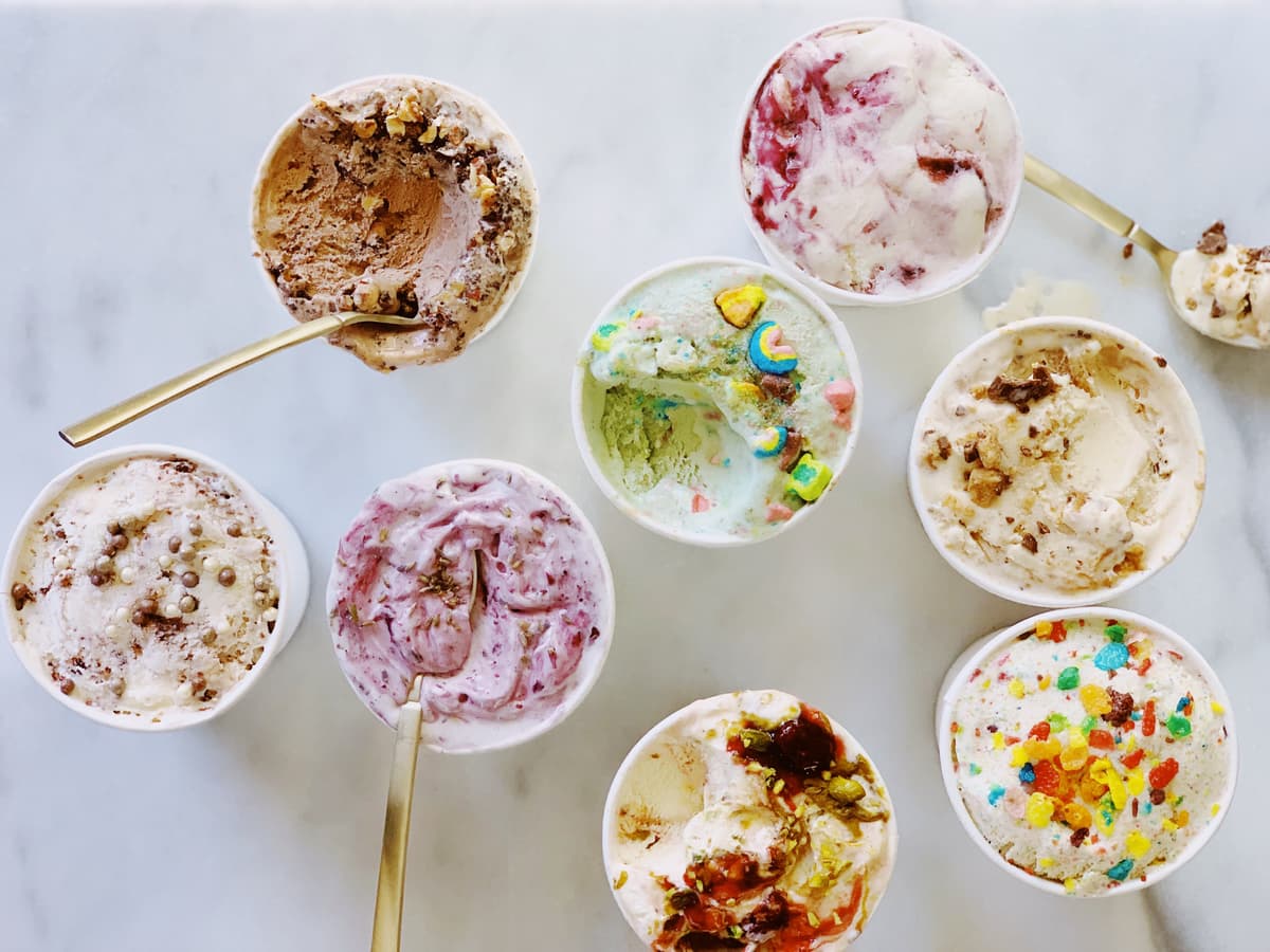Open pints of Chunk-N-Chip small-batch ice cream flavors, viewed from above