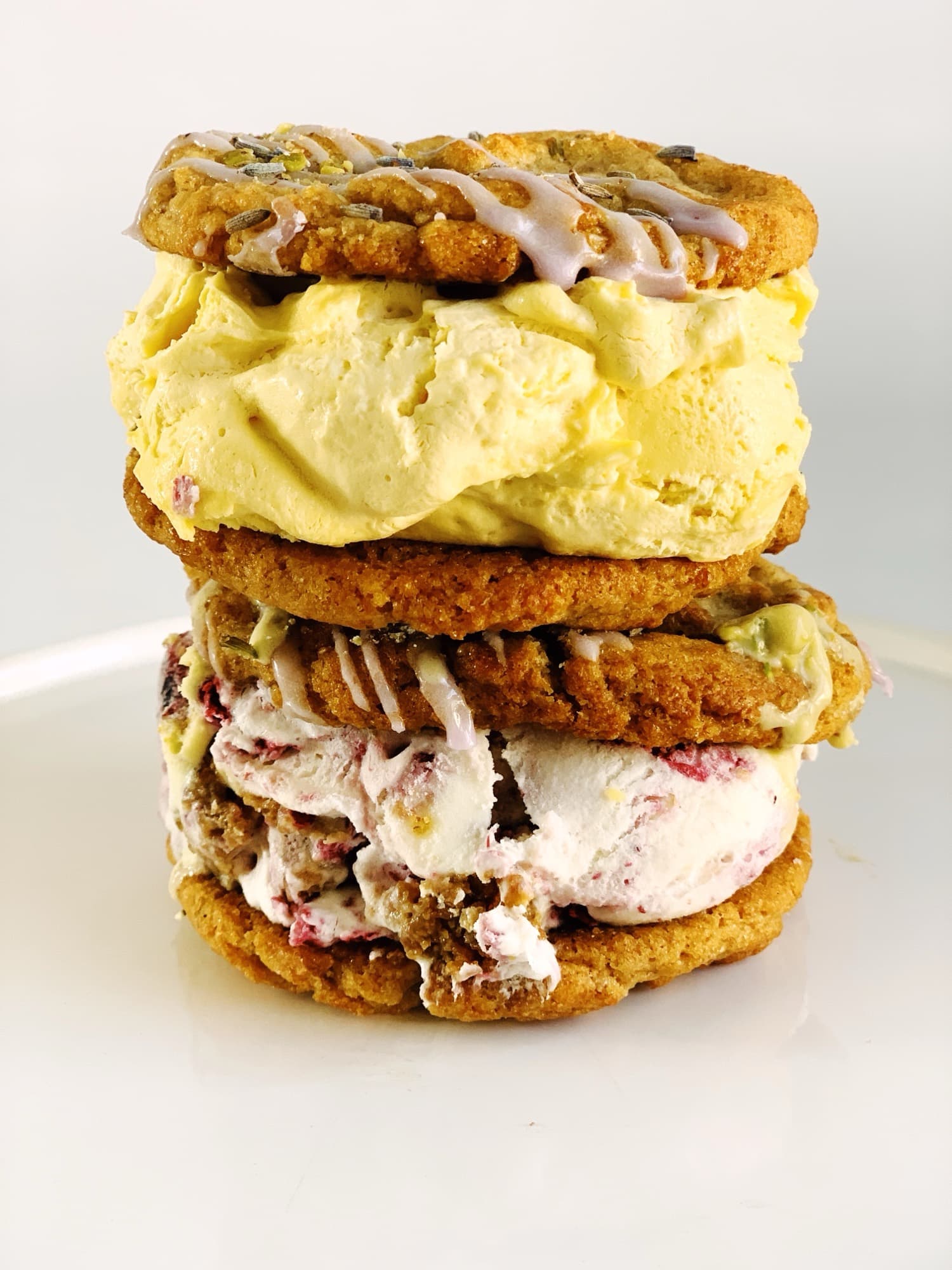 Two Chunk-N-Chip ice cream sammiches stacked on a white plate
